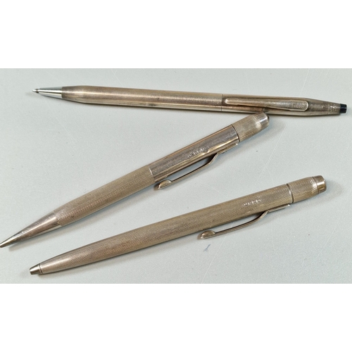 235 - Two silver engine turned writing implements, together with another Cross 925 silver pen. (B.P. 21% +... 