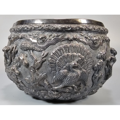 251 - Indian/Burmese white metal bowl, highly decorated in relief figures, animals including elephants, ra... 