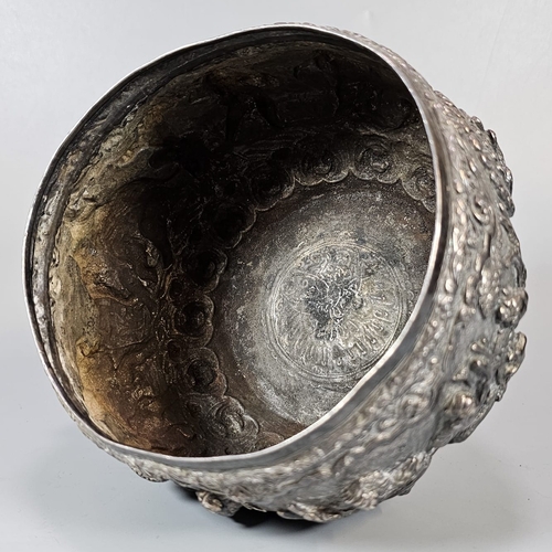 251 - Indian/Burmese white metal bowl, highly decorated in relief figures, animals including elephants, ra... 