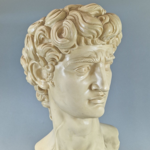 31 - Modern and decorative resin Grecian bust of a man, on circular plinth.  (B.P. 21% + VAT)