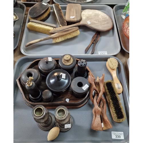 330 - Two trays of assorted ebony and other hardwood items to include: candlesticks, hair brushes, vanity ... 