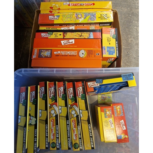 383 - Four boxes of The Simpsons jigsaws and board games to include: Monopoly, circular jigsaws, Battle of... 