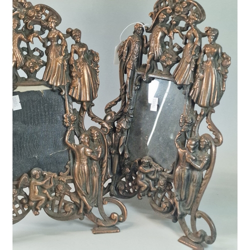 51 - Pair of cast metal copper finish easel picture frames depicting figures and cherubs. 37cm high appro... 