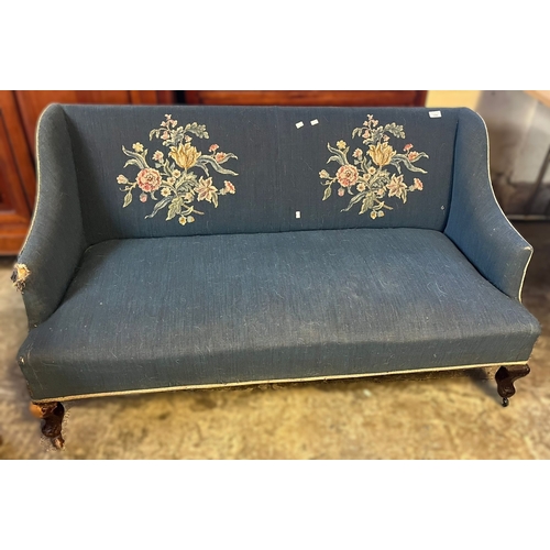 586 - Early 20th century upholstered wing design two seater sofa with floral and foliate decoration. (B.P.... 