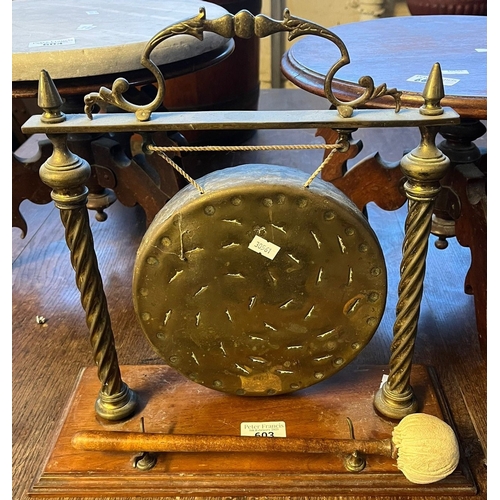 603 - Early 20th century brass dinner gong, with striker on oak moulded base. (B.P. 21% + VAT)