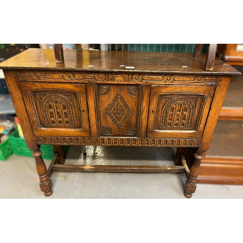 615 - 17th century style carved oak sideboard, together with an early 20th century stained towel rail. (2)... 