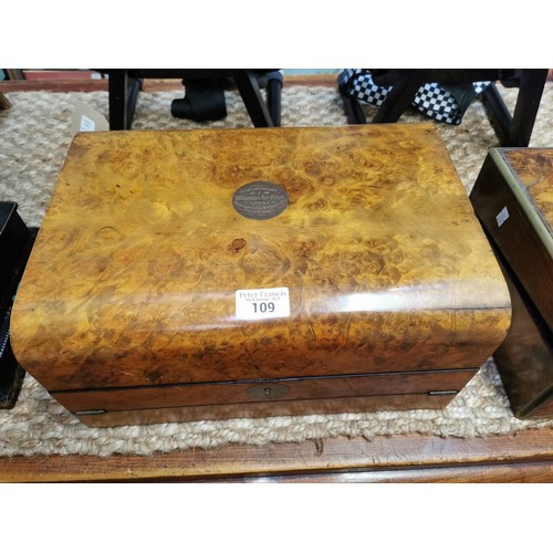 109 - Late Victorian burr walnut writing slope, the turned and moulded top with presentation plaque dated ... 