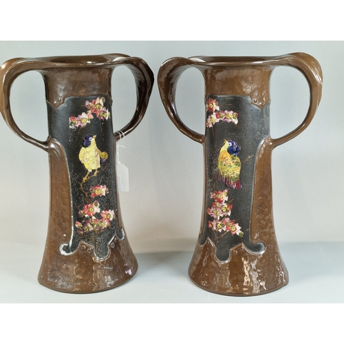 13 - Pair of Bretby Pottery Art Nouveau design twin handled vases, decorated with flowers and foliage, ra... 