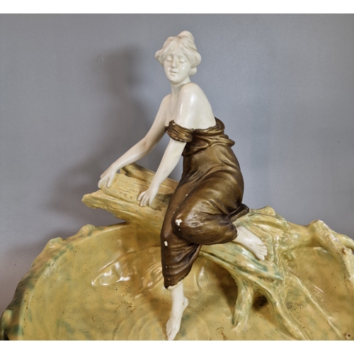 14 - Continental Art Nouveau pottery lily pond, with seated lady on tree trunk. 27cm high approx. Togethe... 