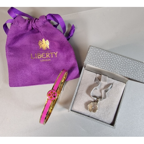 19 - Liberty of London, candy pink enamel gold plated bangle in original box and pouch, together with a m... 