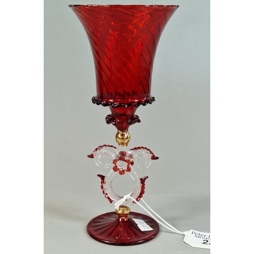 23 - Murano ruby ground writhen Tipetto glass goblet. 20.5cm high approx.  (B.P. 21% + VAT)