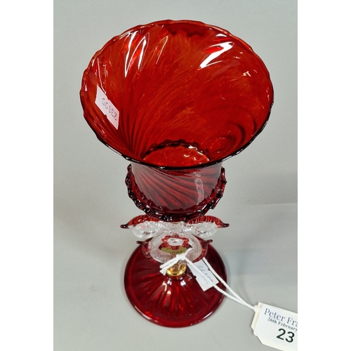 23 - Murano ruby ground writhen Tipetto glass goblet. 20.5cm high approx.  (B.P. 21% + VAT)