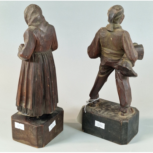 31 - Pair of European carved softwood figures of a jovial man and an old lady. 25cm high approx. (2) (B.P... 