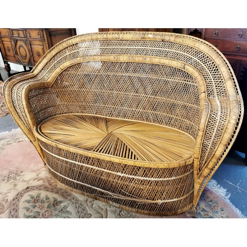 586 - Middle Eastern style double caned conservatory sofa with arched back and bow fronted seat. 145cm wid... 