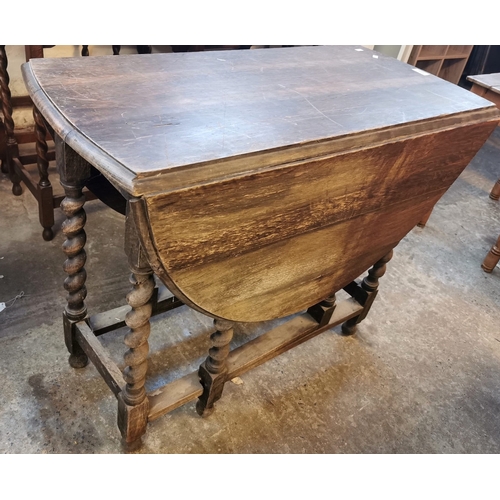 588 - Four similar early 20th century oak barley twist lamp or occasional tables together with an early 20... 