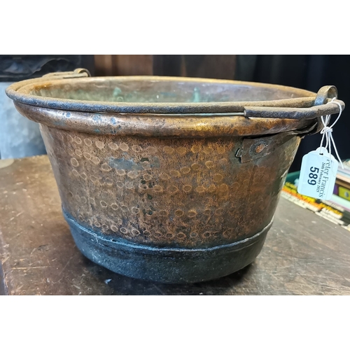 589 - 19th century beaten copper bucket with iron swing handle. (B.P. 21% + VAT)