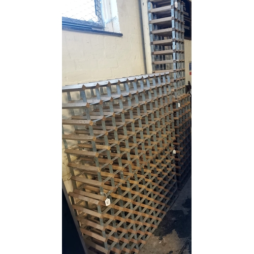 594 - A collection of vintage wooden and metal wine racks. (4) (B.P. 21% + VAT)