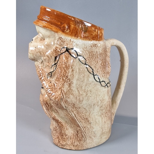 6 - Novelty pottery single handled pitcher jug, modelled as a monkey. 21.5cm high approx. (B.P. 21% + VA... 