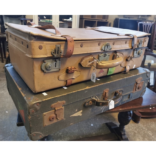 609 - Vintage leather suitcase together with a vintage canvas suitcase. (B.P. 21% + VAT)