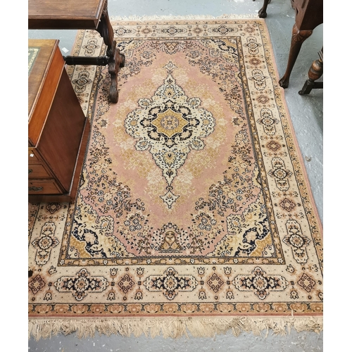 617 - Modern Chinese washed ground floral and foliate pink ground carpet of oval form. 276x186cm approx. T... 