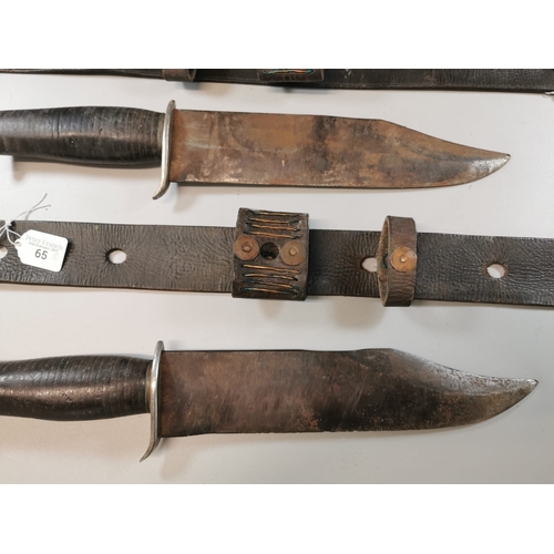 65 - Two similar large heavy steel Bowie knives, both with with metal hilts and leather bound grips and h... 