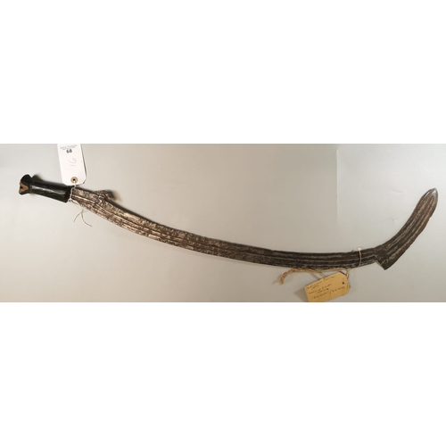 68 - Probably African tribal sword with curved and fluted inner edged notched blade and wooden grip. Poss... 