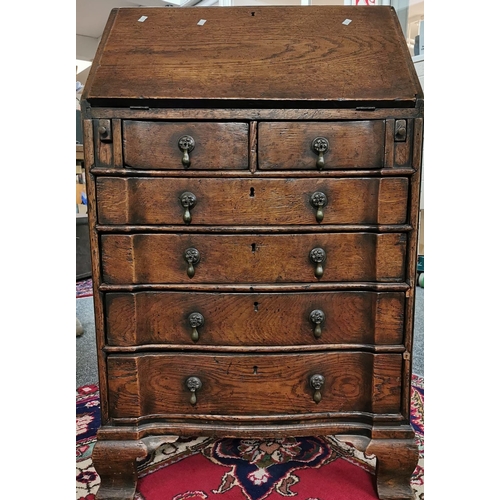 21 - Georgian style oak fall front bureau, of narrow proportions, the interior revealing two drawers and ... 