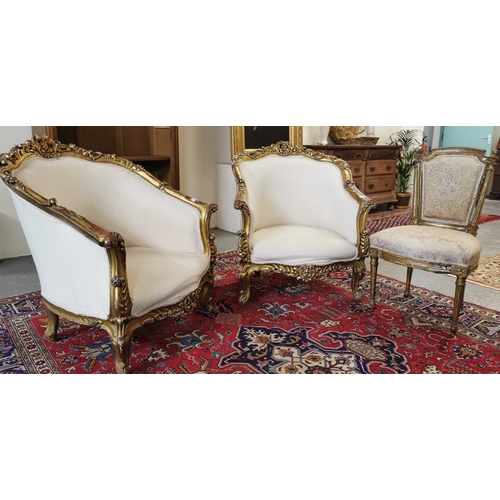 24 - Pair of Louis XV style cream and gilded gold gesso chairs, the frame having pierced foliate decorati... 