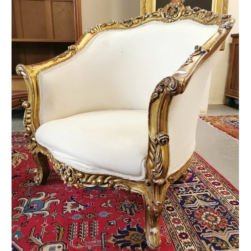 24 - Pair of Louis XV style cream and gilded gold gesso chairs, the frame having pierced foliate decorati... 