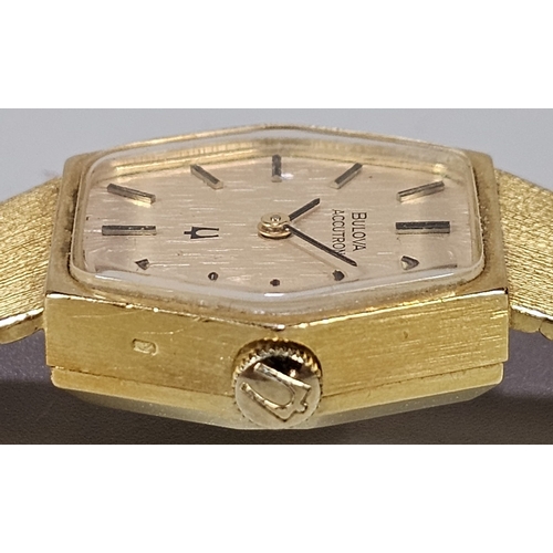 456 - 18ct gold Bulova Accutron ladies' bracelet wristwatch. Having gilt face with Baton numerals and inte... 