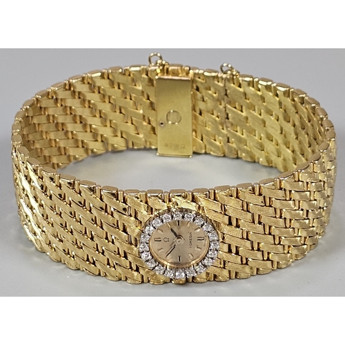 465 - A Spectacular 18ct gold and diamond ladies' Omega cuff watch, having gilt face with Baton numerals a... 