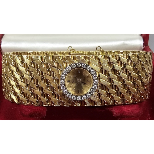 465 - A Spectacular 18ct gold and diamond ladies' Omega cuff watch, having gilt face with Baton numerals a... 