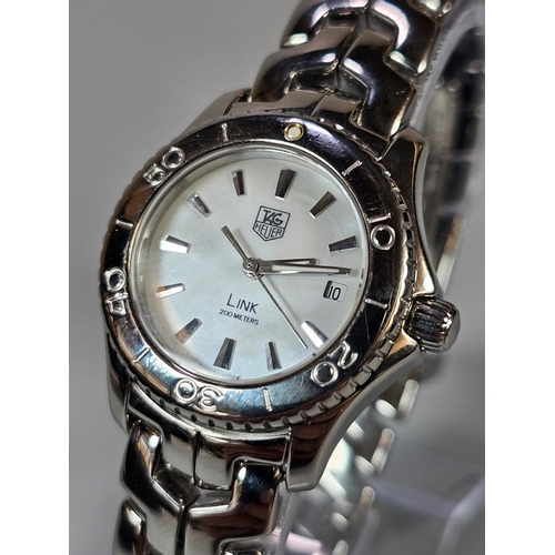 469 - Tag Heuer ladies' steel Link 200 Meters bracelet wristwatch, with white face, having Baton numerals,... 