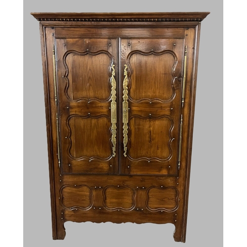 6 - 19th century French oak armoire, the moulded cornice above two blind panelled doors with fielded orn... 