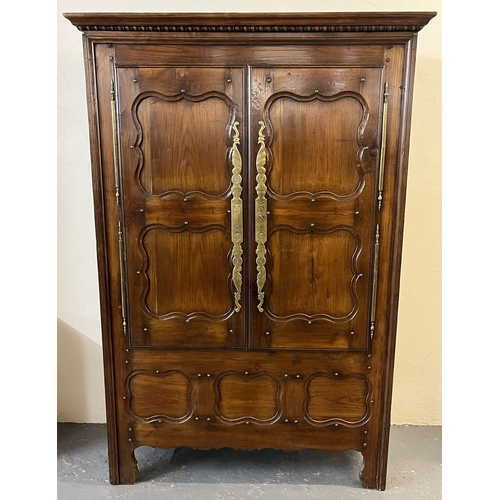 6 - 19th century French oak armoire, the moulded cornice above two blind panelled doors with fielded orn... 