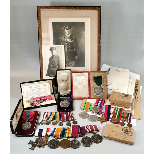 A superb WWI and WWII Family Medal Group awarded to Sergeant Major Arthur Ernest Gray (Coldstream Guards), his son Lieutenant Stanley Arthur Gordon Gray (Royal Artillery), and Daughter Dorothy Gray.

Medals Awarded to Sergeant Major Arthur Ernest Gray (Coldstream Guards):
The Most Excellent Order of the British Empire, MBE (Military 2nd type), with miniature, cased. Military Cross (George V, un-named), 1914 Star (1922, C.S.M. MJR. DR. SJT. A. GRAY C. GDS), British War Medal 1914-20 (1922 W. O. C. I. A. GRAY. C. GDS.), Victory Medal (1922 W. O. C. L. 1. A. GRAY. C. GDS), with leaf, Jubilee Medal 1935, Army Long Service and Good Conduct  (George V, post 1917 ribbon - "1922 S.MJR A.GRAY C.GDS"), Army Meritorious Service Medal (George V - "1922 S.MJR A.GRAY M.C 3/C.GDS"). Defence Medal (1945), War Medal 1939-45, 1911 Army Rifle Association - Roberts Cup (hallmarked silver) and 1912 Army Rifle Association Medal (cased).

Son, Lieutenant S.A.G. Gray (Royal Artillery), War Medal 1939-45, 1939-45 Star, Pacific Star (all un-named).

Daughter, Dorothy Ethel Gray - Imperial Service Medal (cased). 

Together with a large collection of ephemera, military certificates, pictures and framed portrait of Serg. Major A. Gray. One document dated 30th April 1916 from the War Office 'Mentioned in Dispatches', signed by Winston Churchill. Documents regarding the death and burial of Lieutenant S.A.G. Gray in Singapore, Feb 1942.  (B.P. 21% + VAT)