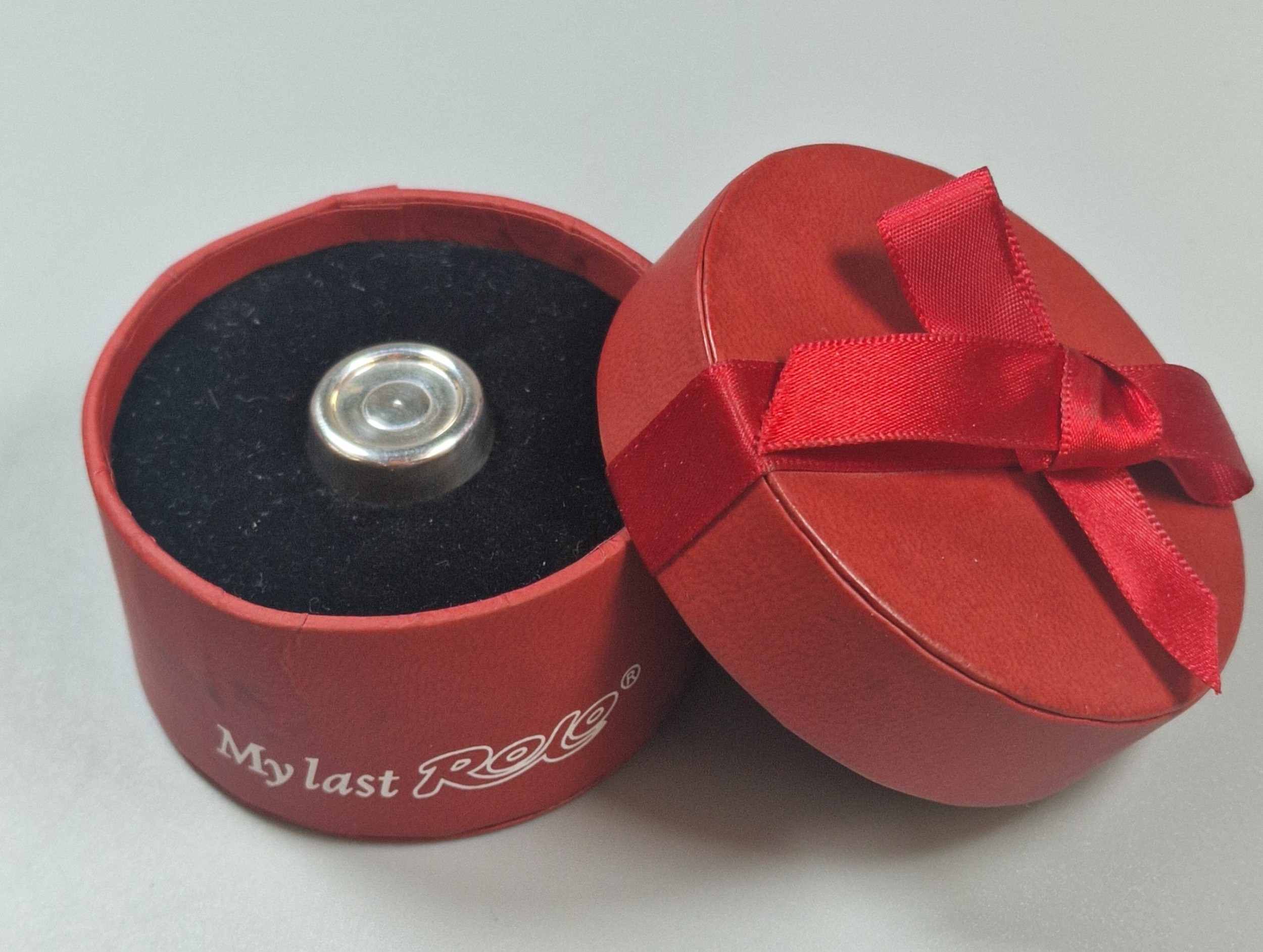 Solid silver 'My Last Rolo', in original box, maker's mark CWS ...
