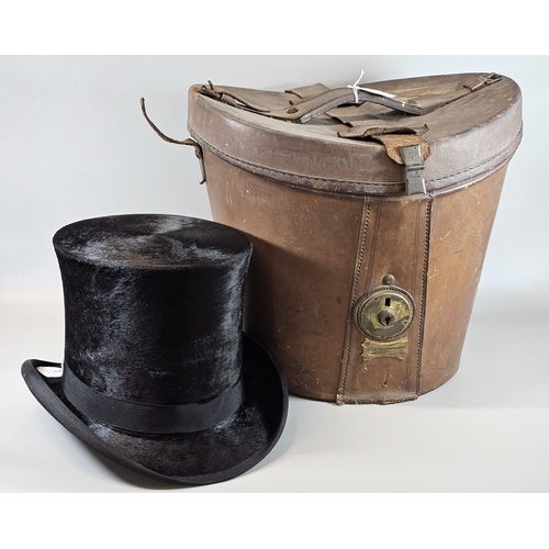 82 - A Victorian silk top hat in fitted leather hat box, the hat internal dimensions: 20x17cm approx. (B....