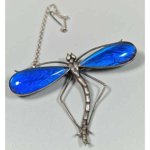 Art Deco design silver dragonfly brooch, with blue wings, marked England Sterling. 10.6g approx. (B.P. 21% + VAT)