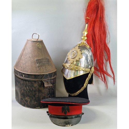 1st Royal Dragoons 1871 Pattern cavalry helmet, with tin named to “R.H. Baskerville Esq., Royal Dragoons”. Together with a 1st Royal Dragoons officer’s visor cap by Hawkes & Co.

The helmet features twelve-pointed star, fluted plume holder with red horsehair plume, foliate ear rosettes, leather-backed chin scales and lining. Tin with maker’s name “Hawkes & Co, 14 Piccadilly, London”.

Captain Ralph Hopton Baskerville (Glamorgan Yeomanry and 1st Royal Dragoons) was killed in action at Fleurbaix, France, on 9th April 1918, aged 35. The Baskerville family were purportedly an inspiration for Sir Arthur Conan Doyle’s The Hound of the Baskervilles; Doyle was a friend of the family and often visited their estate, Clyro Court near Hay-on-Wye. (3) (B.P. 21% + VAT)