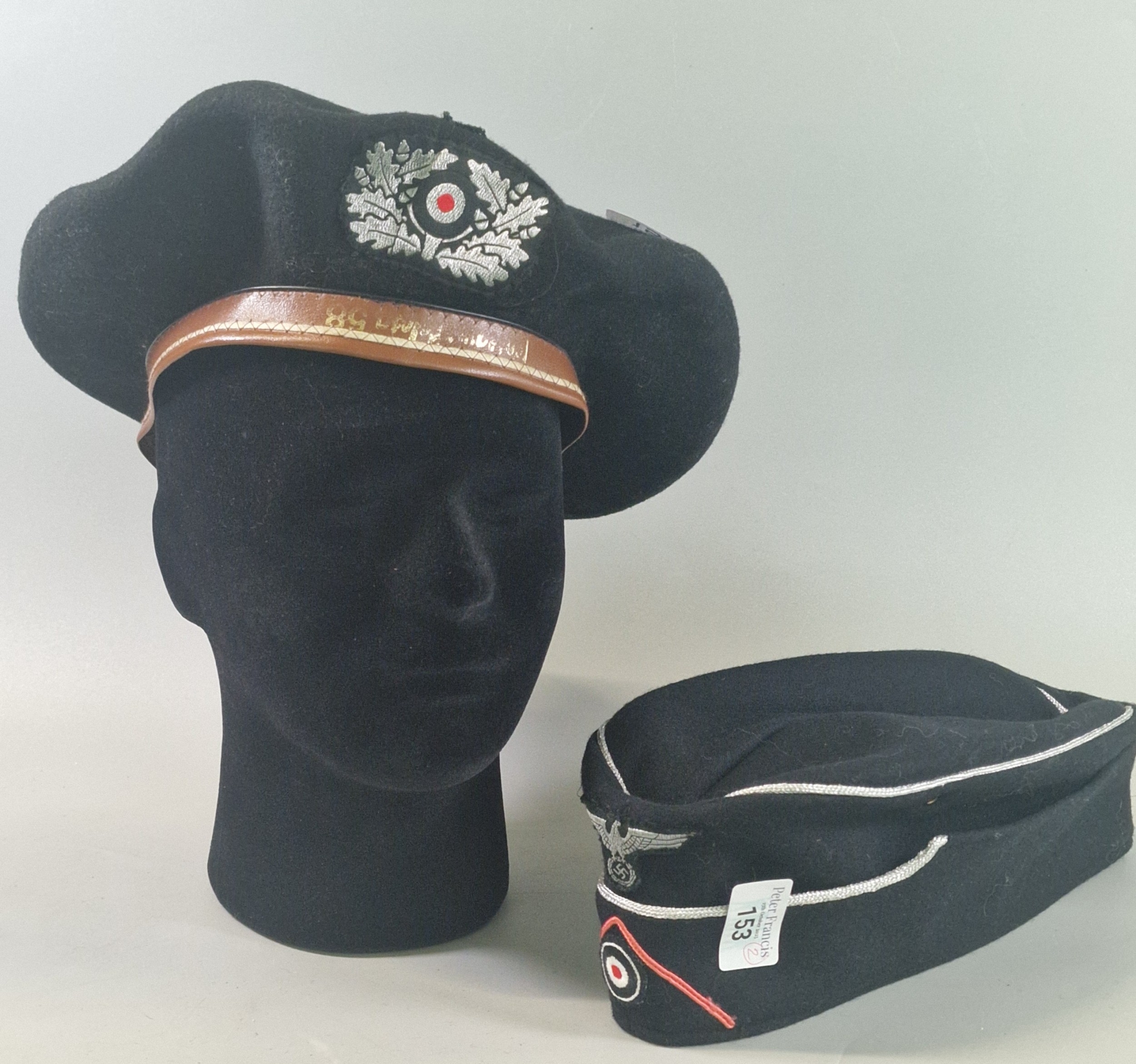 Two German Third Reich-style caps, comprising a Panzer officer’s M38 ...