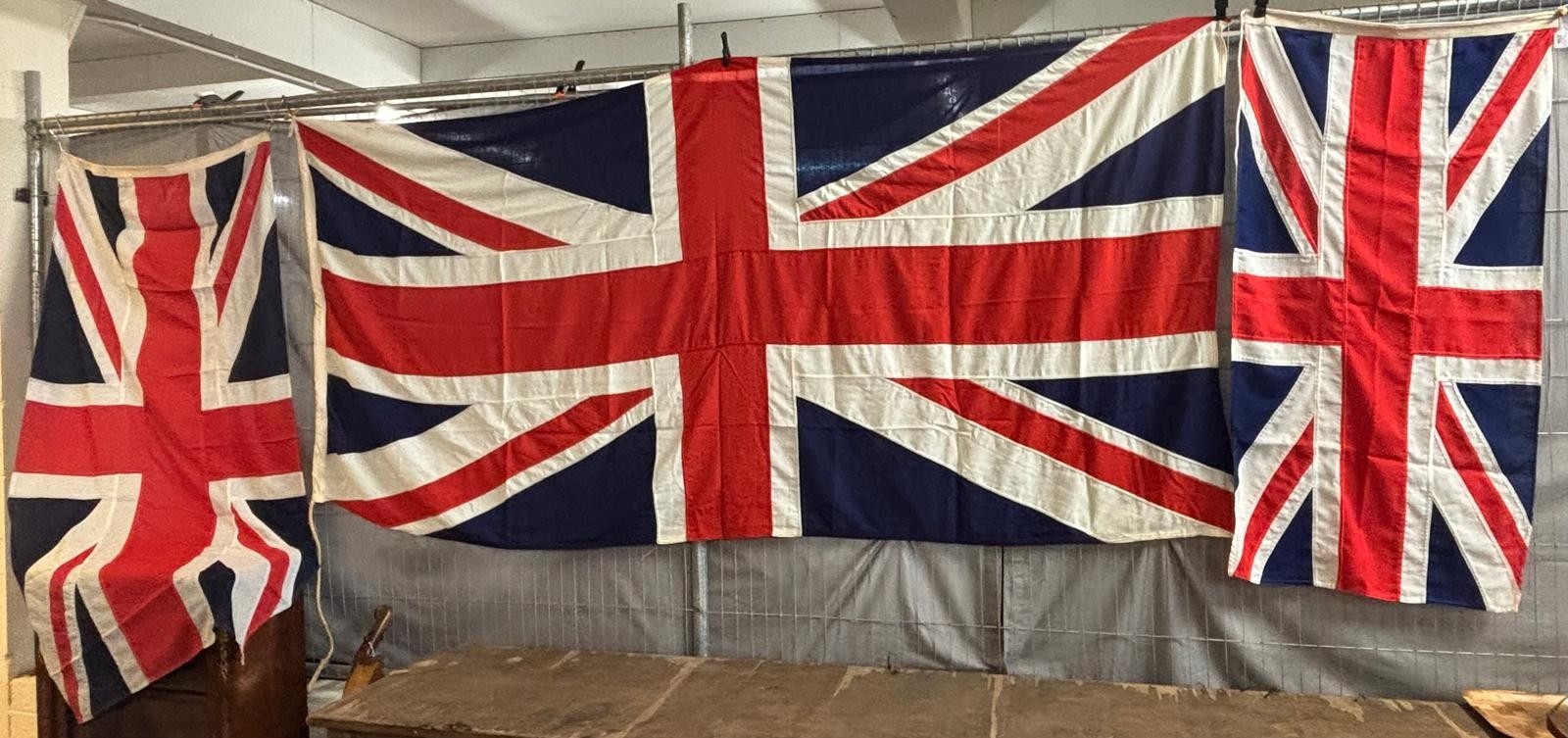 Collection of four large Union Jack flags, various sizes including ...