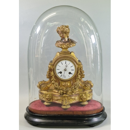 19th century French gilt spelter mantel clock, the case foliate decorated with portrait bust pediment, enamel Roman face under a glass dome on base. The clock 35cm high approx. (B.P. 21% + VAT)