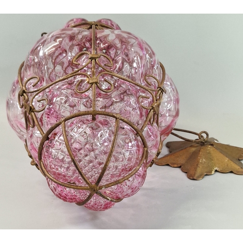 Pink raspberry glass pendant lamp in a metal cage. Possibly Murano. (B ...