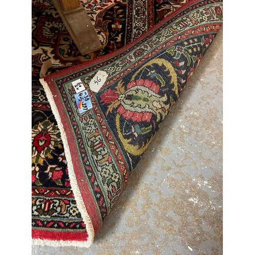Large blue and red ground Iranian carpet with central floral medallion ...