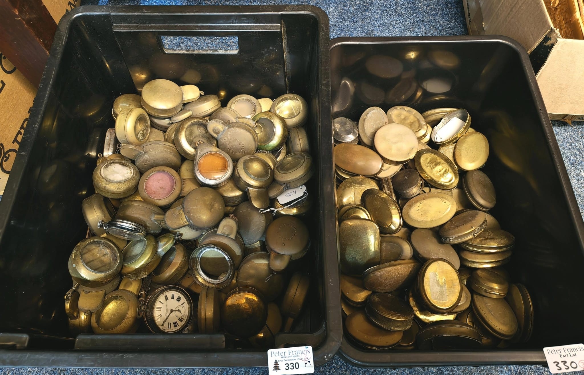 Two plastic boxes with a collection of mainly brass Miner's snuff boxes ...