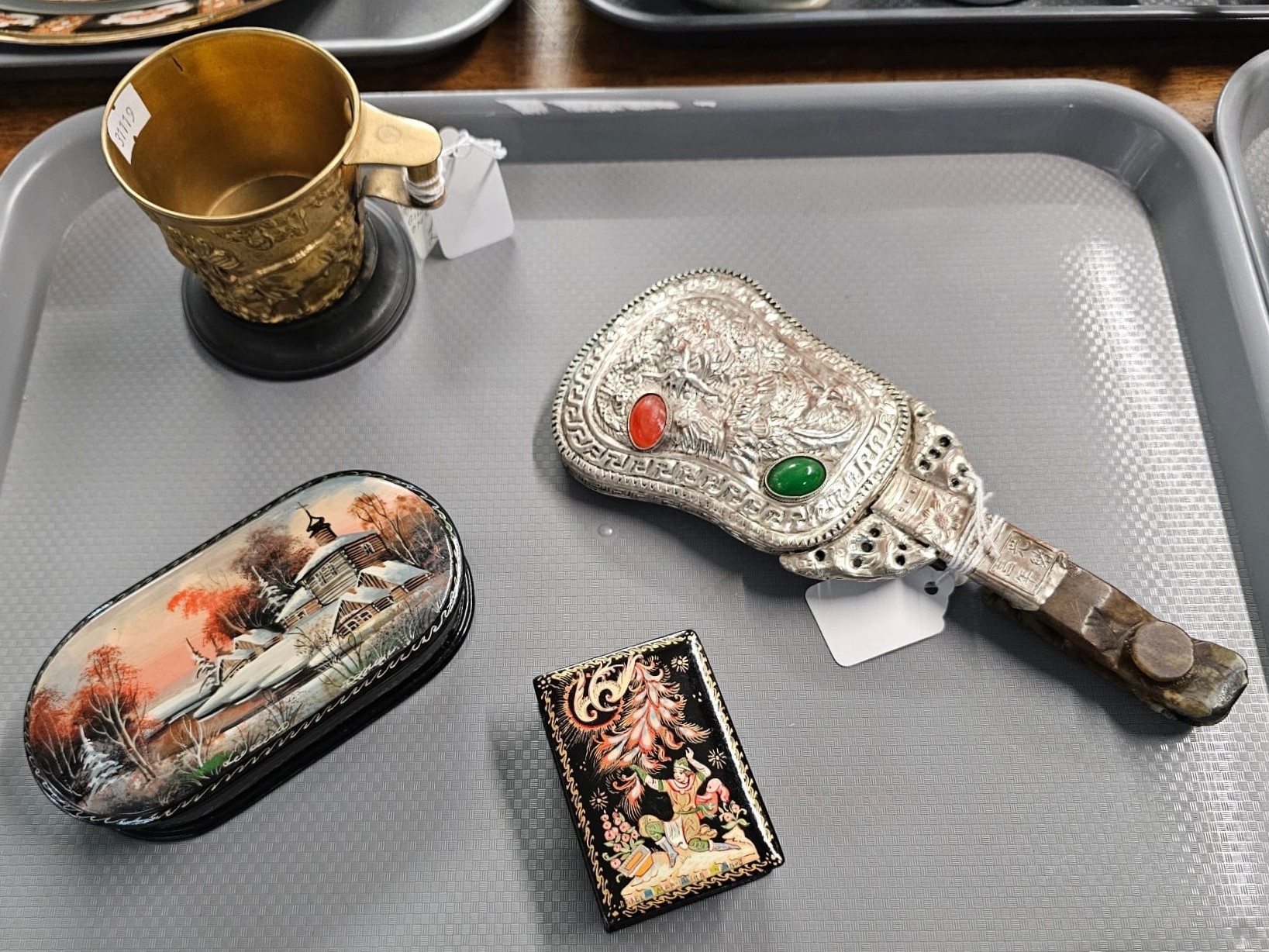 Collection of items to include: animal repoussé decorated cup on stand ...