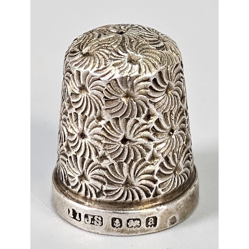 Silver urn shaped pepperette, together with a silver topped jar cover ...