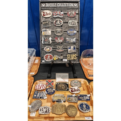 445 - Collection of Elvis Presley belt buckles including a buckle collection on wooden frame. (B.P. 21% + ... 
