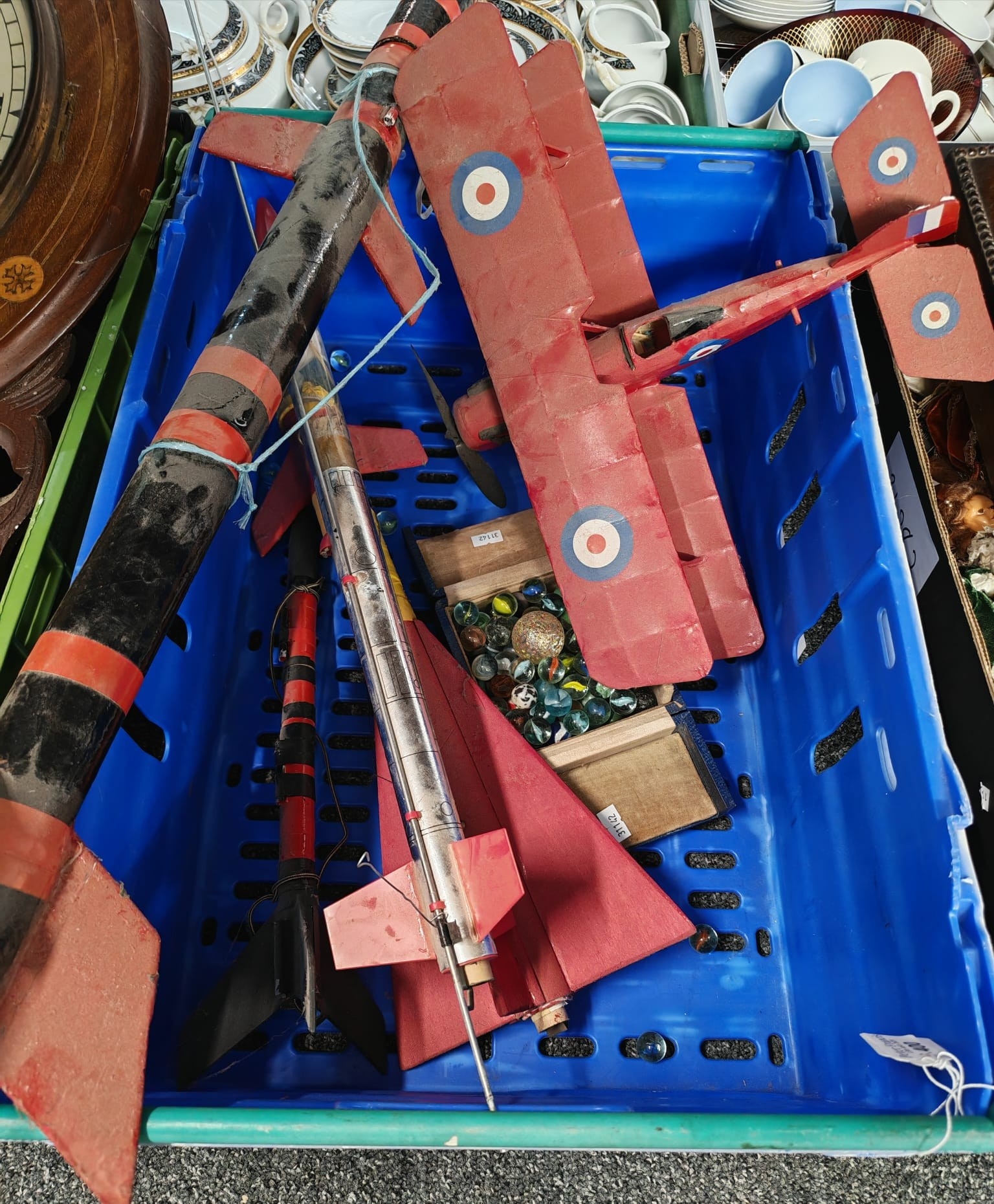 Crate of items to include: four model rockets of varying sizes, model ...